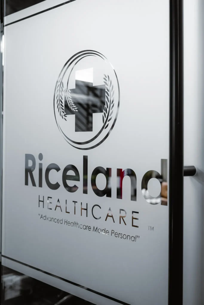 Riceland Healthcare logo on glass