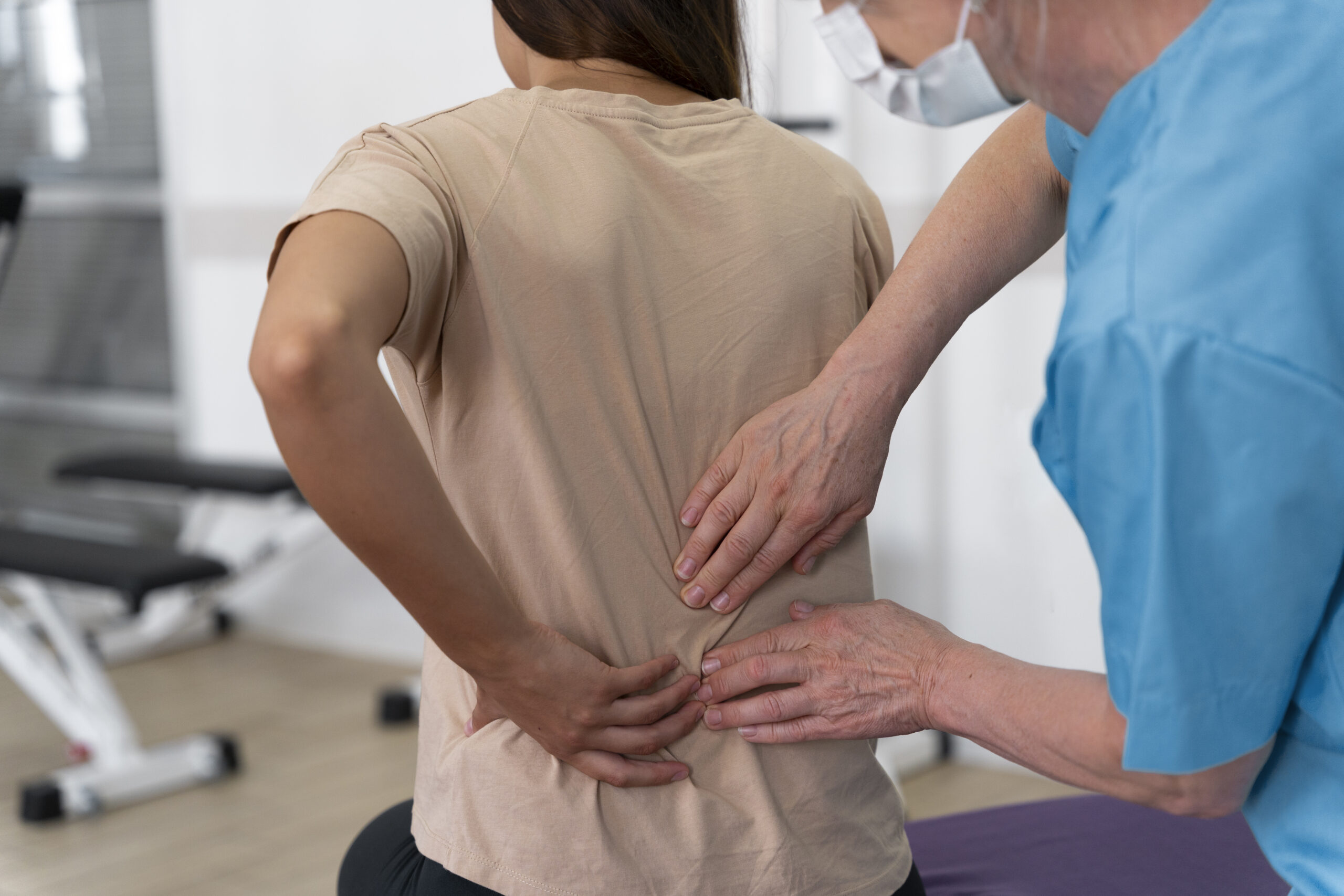Medical Assistant Helping Patient Physiotherapy